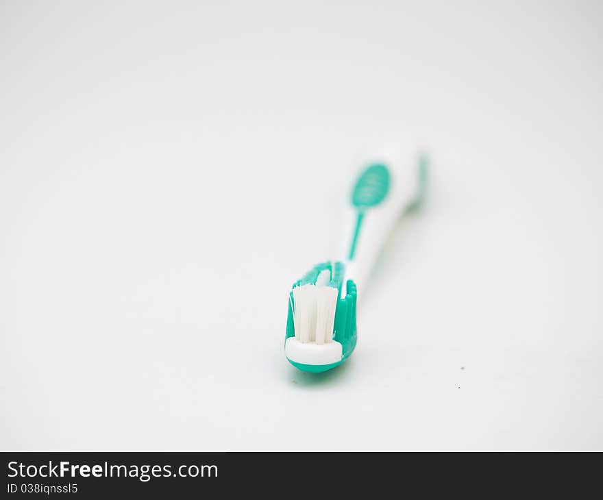 Tooth brush on a white background