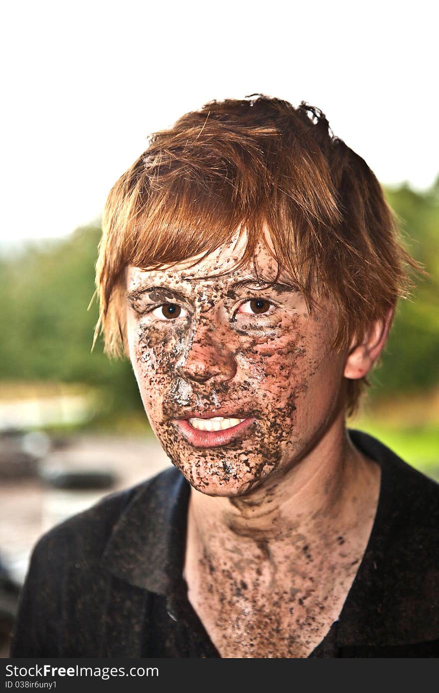 Boy has dirt in his face from driving Quad