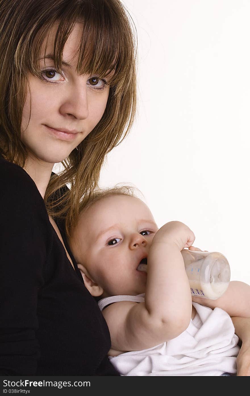 Young mother feeding her baby