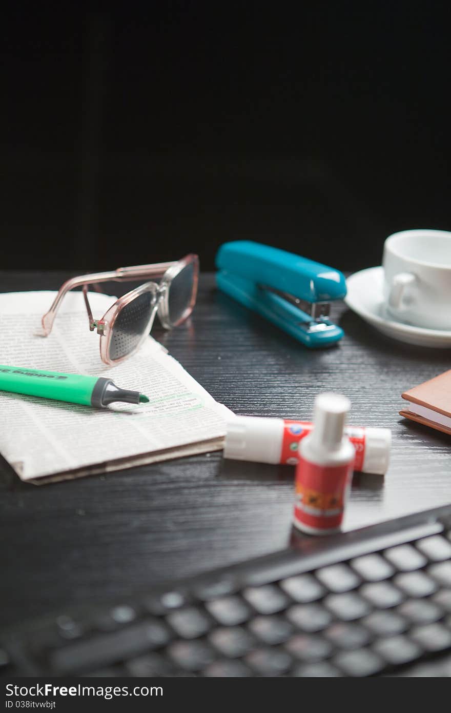 Close-up of glasses documents pen cup of coffee on the table. Close-up of glasses documents pen cup of coffee on the table