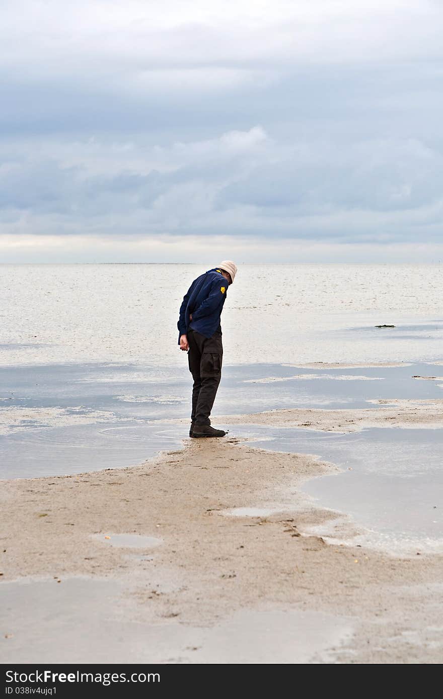 Man Walking In Tidal Flat