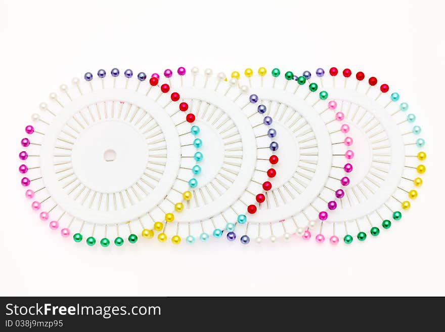 Colorful pins isolated on white background