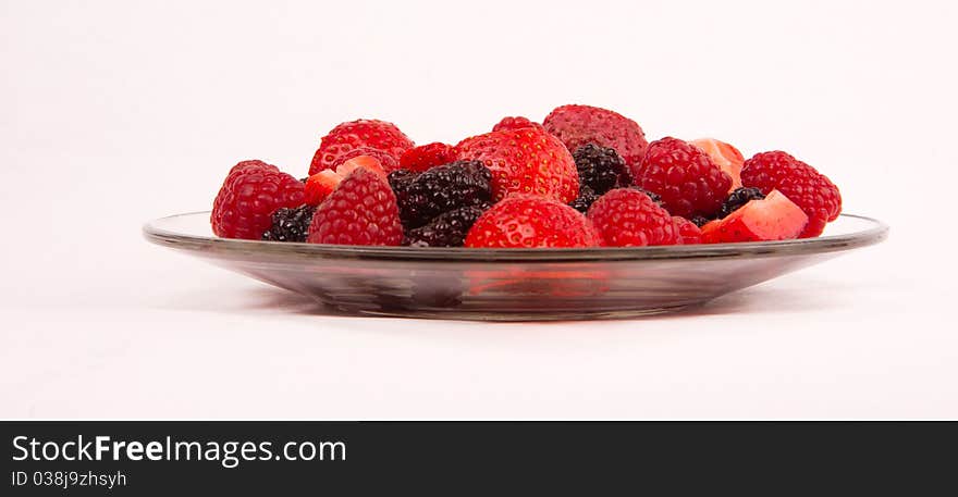 Mixed berries on a class plate. Mixed berries on a class plate