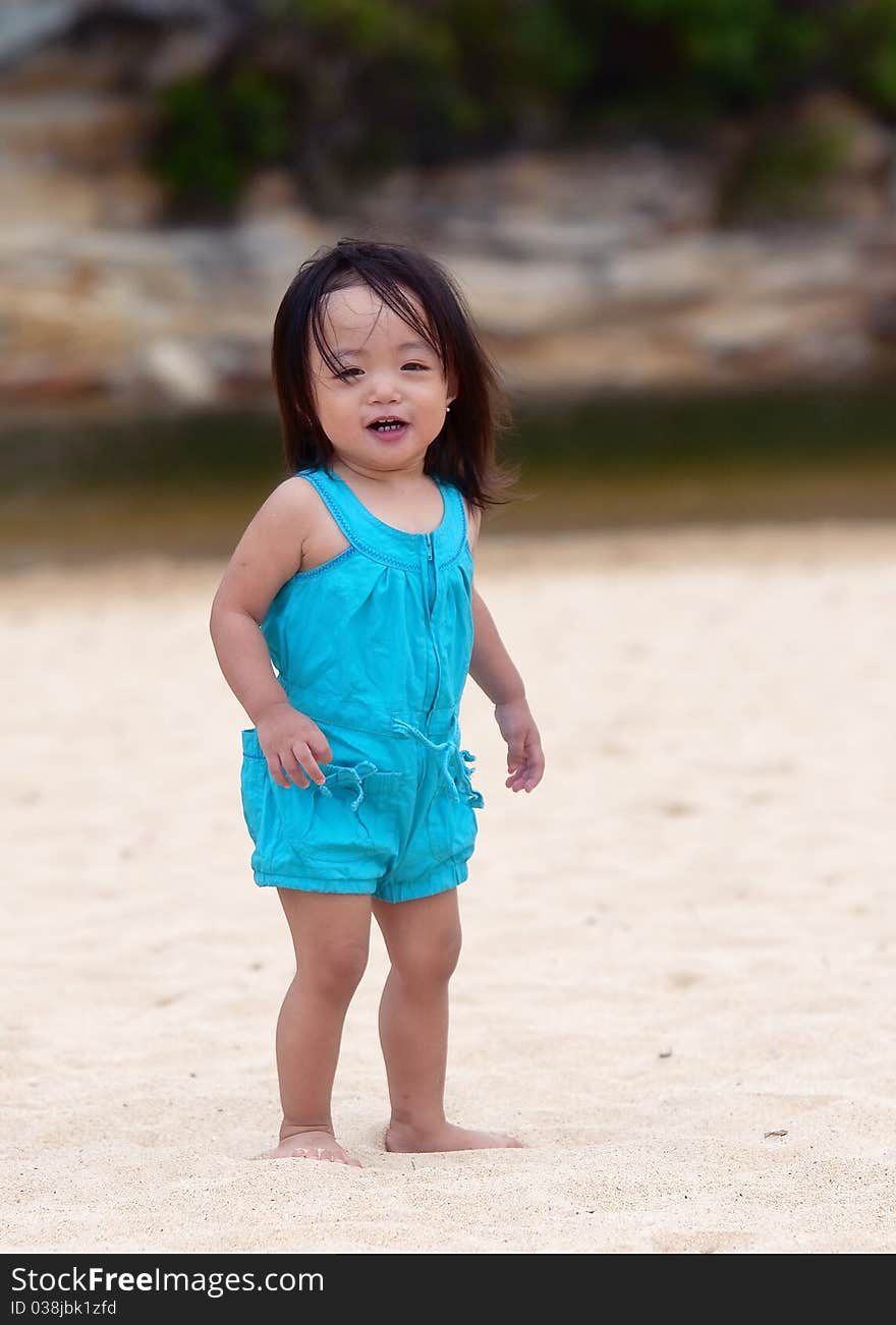 Baby enjoying a fun day at a beach. Baby enjoying a fun day at a beach.