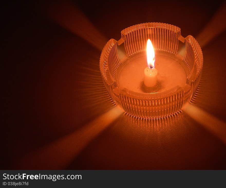 Burning Candle in an ashtray