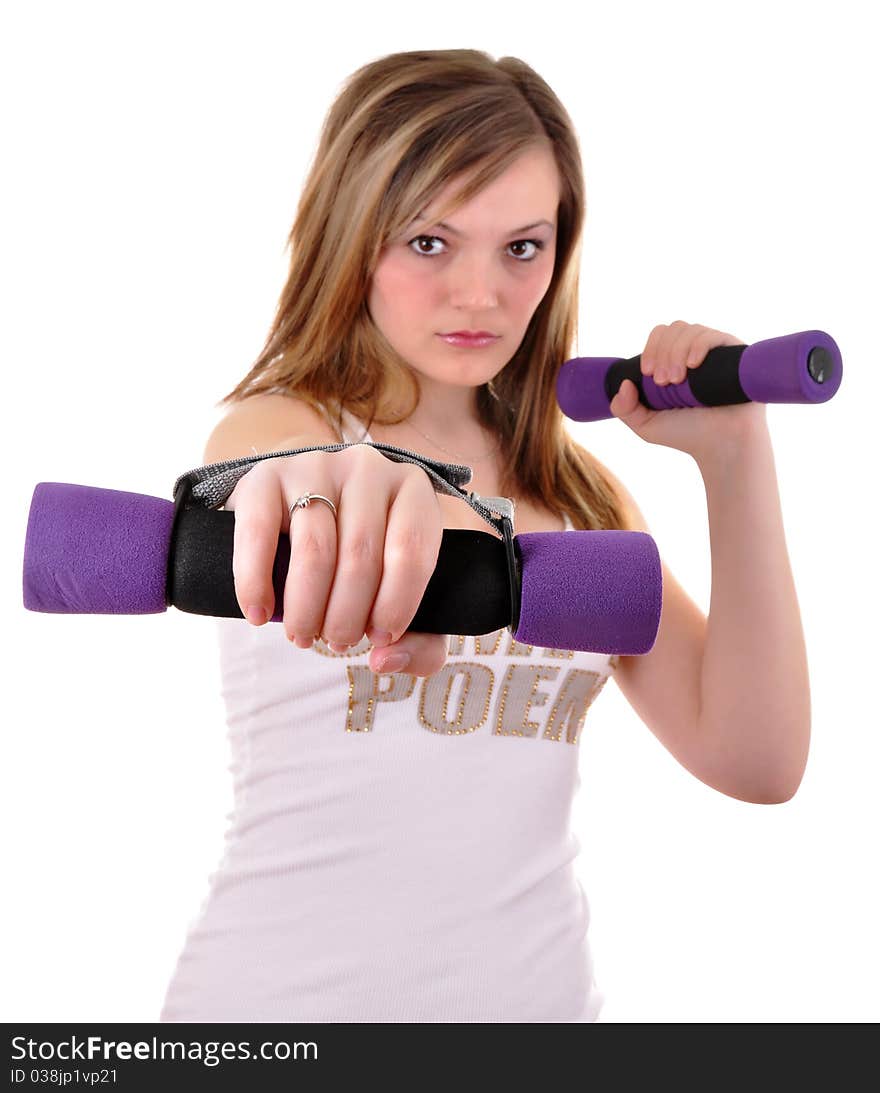 Portrait of fitness woman working out with free weights in gym