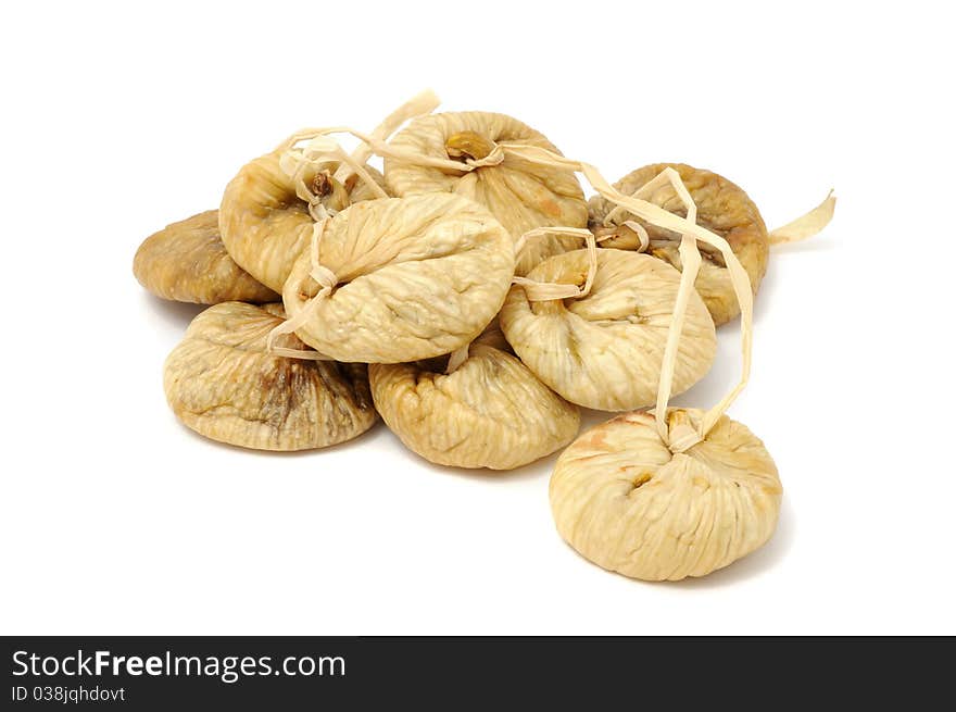 Dried figs on a string isolated on a white background