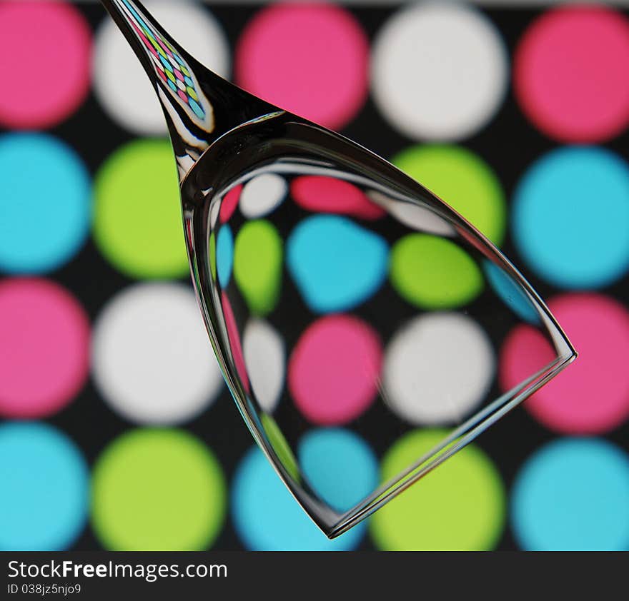 An abstract shot of a single wine glass against a trendy background. An abstract shot of a single wine glass against a trendy background