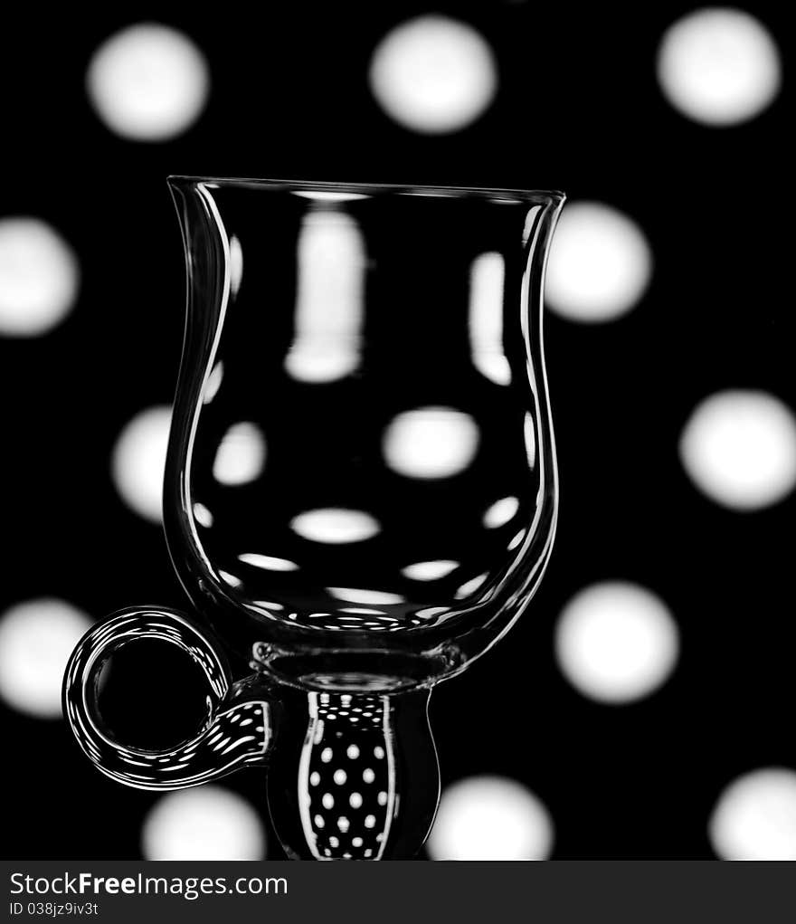 An abstract shot of a single coffee glass against a trendy background. An abstract shot of a single coffee glass against a trendy background