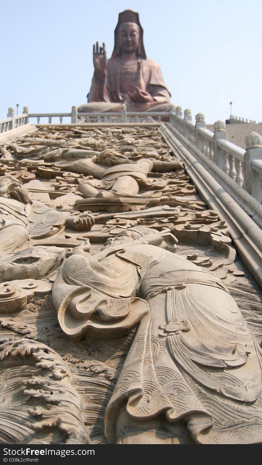 Figure stucco in front of Guan Yin Buddha Statue