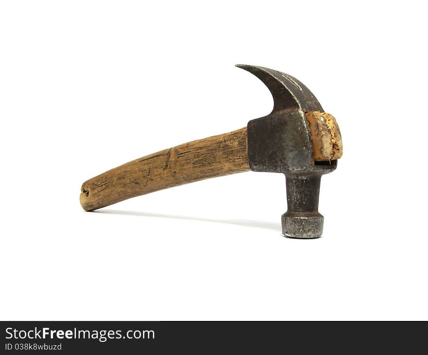 Old hammer with the wood handle on a white background