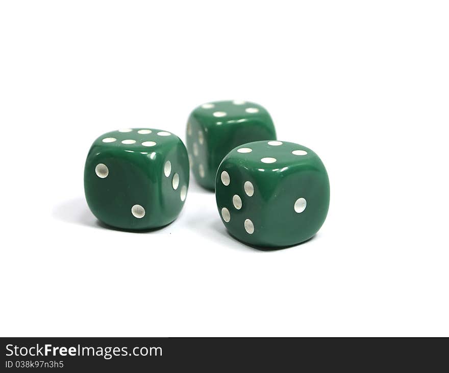 Three green dices on a white background