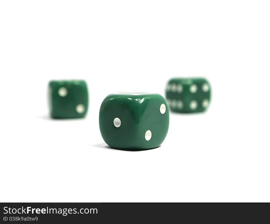 Three green dices on a white background