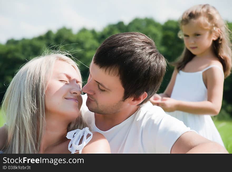 Happy Young family on the meadow. Happy Young family on the meadow