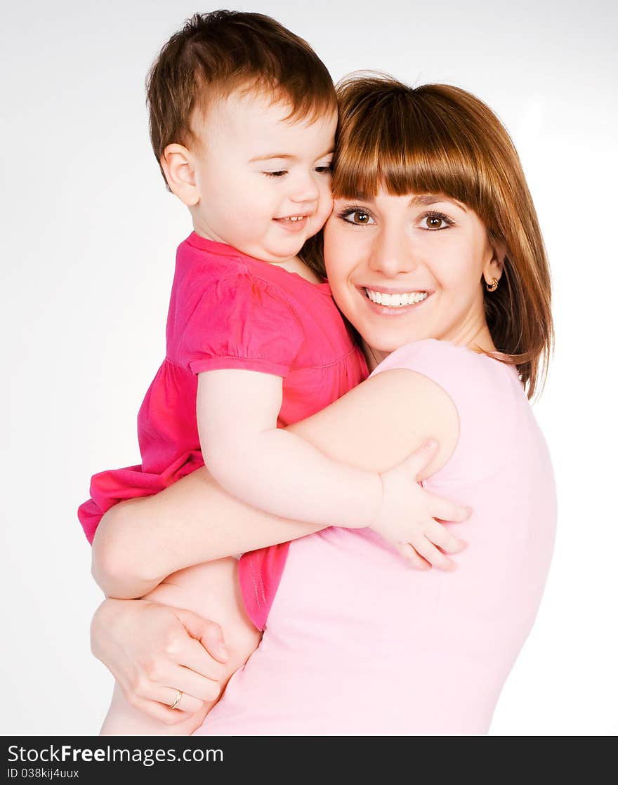 Happy mother with a baby on a white background