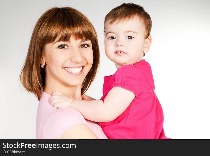 Happy mother with a baby on a white background