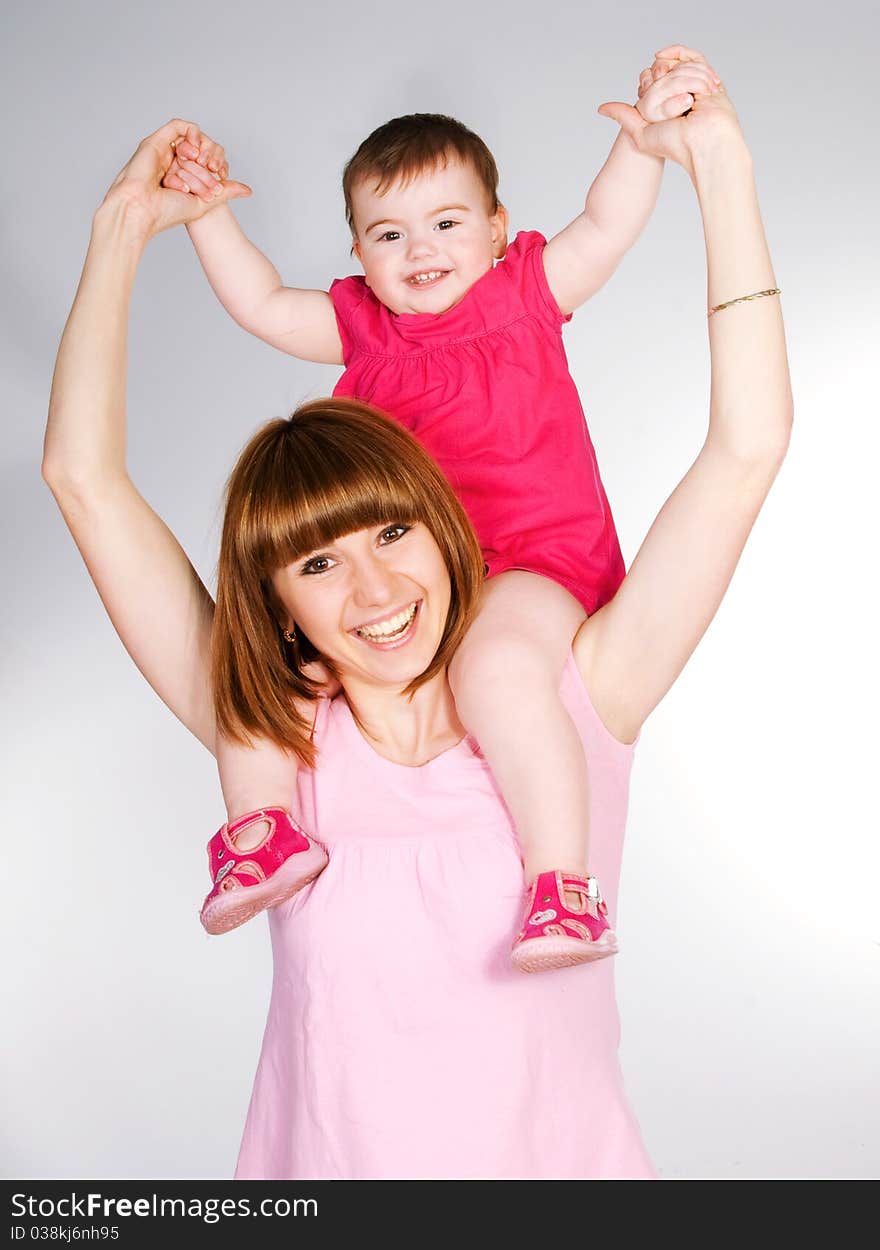 Happy mother with a baby on a white background