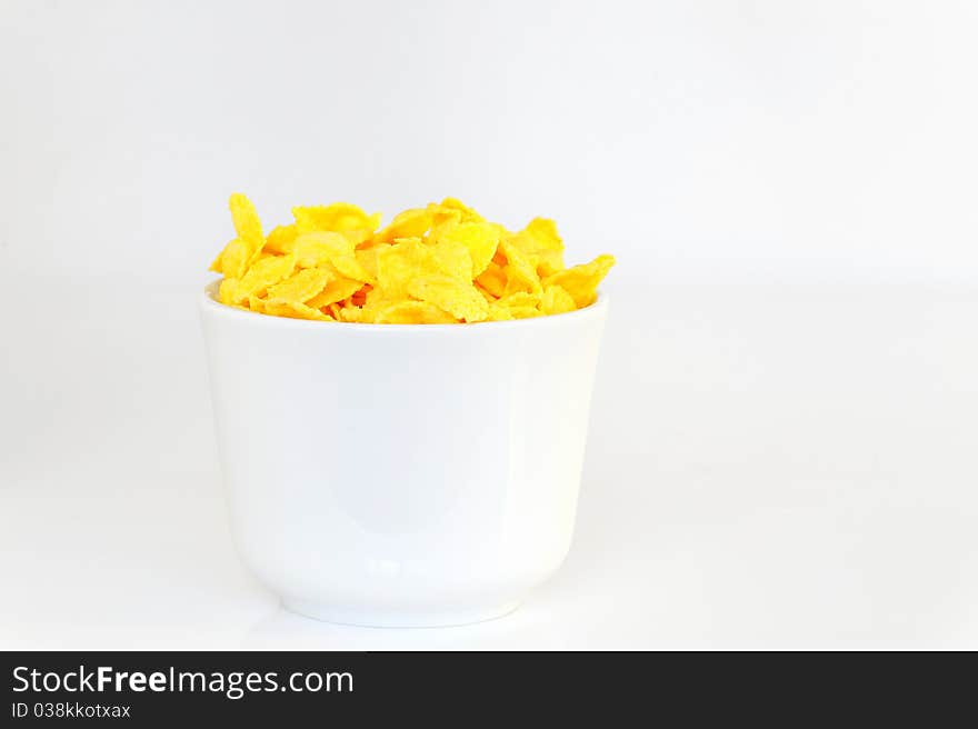 Bowl with corn flake isolated on white