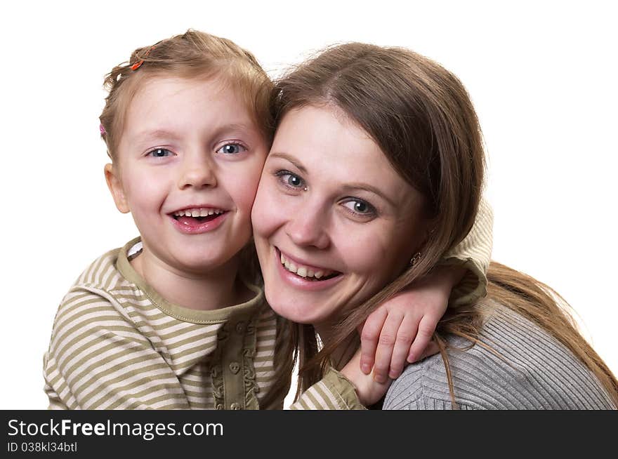 Mother and her little daughter hugging each other isolated over white background. Mother and her little daughter hugging each other isolated over white background