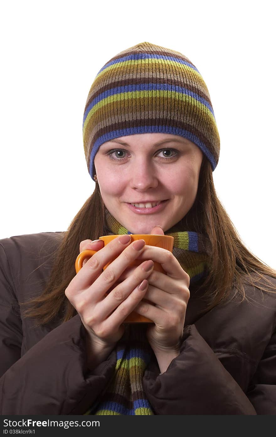 Young woman with orange cup in the hands isolated over white background. Young woman with orange cup in the hands isolated over white background