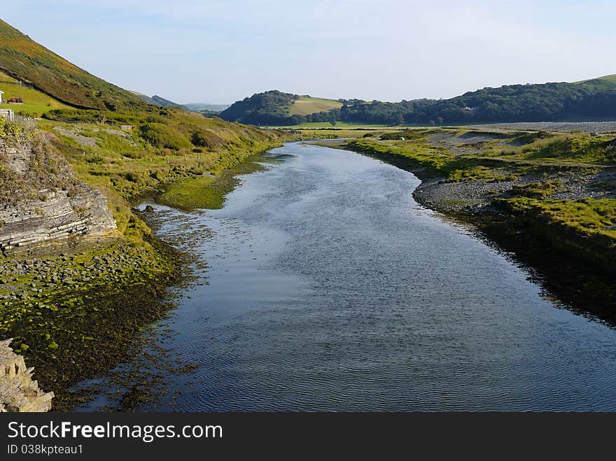 Gorgeous setting of a tranquil outlet from the sea with greenery surrounding. Gorgeous setting of a tranquil outlet from the sea with greenery surrounding.