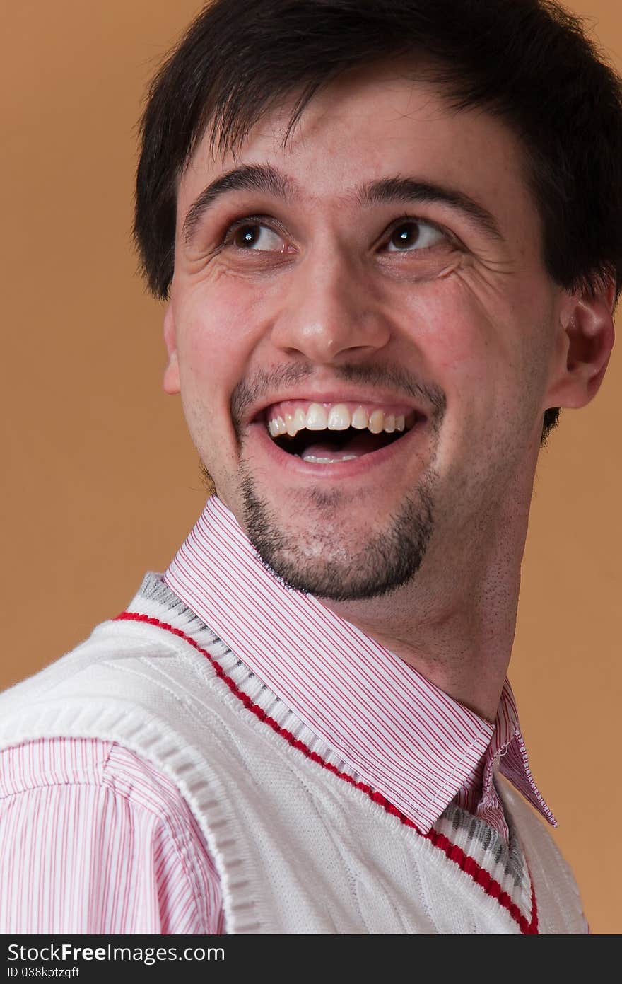 Young man with beard smiling