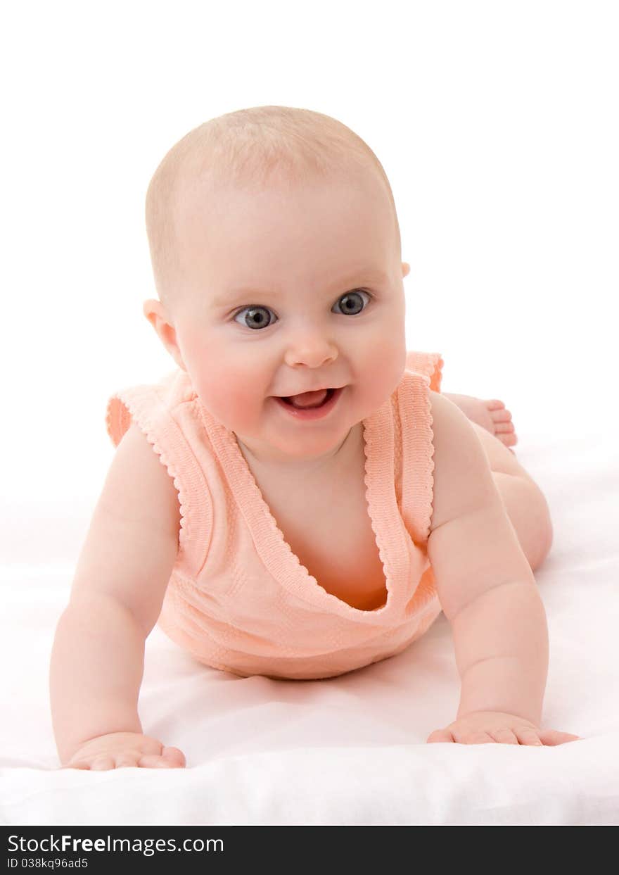 Surprised kid looks at a white background.