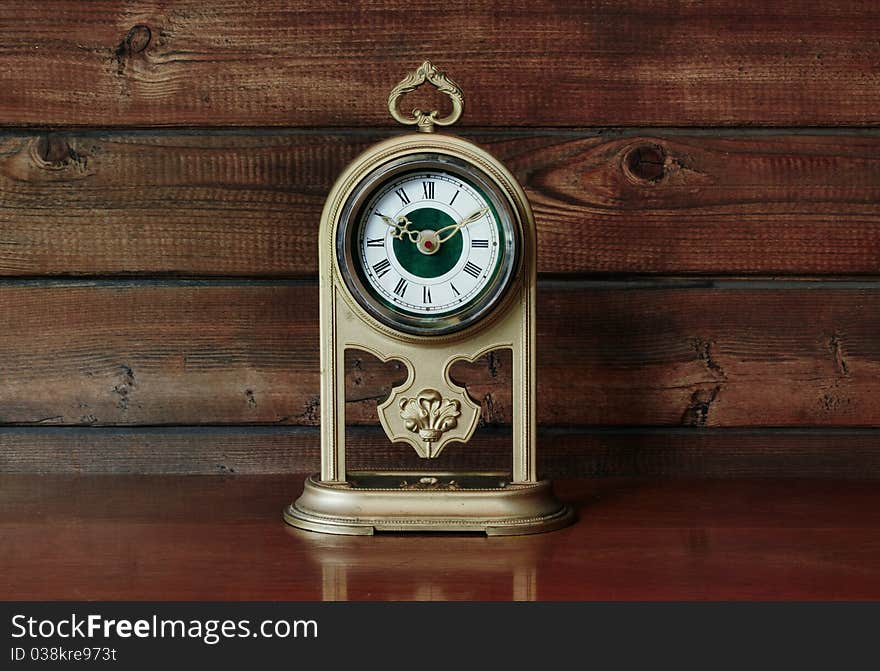 Old Antique Clock on wooden table. Old Antique Clock on wooden table