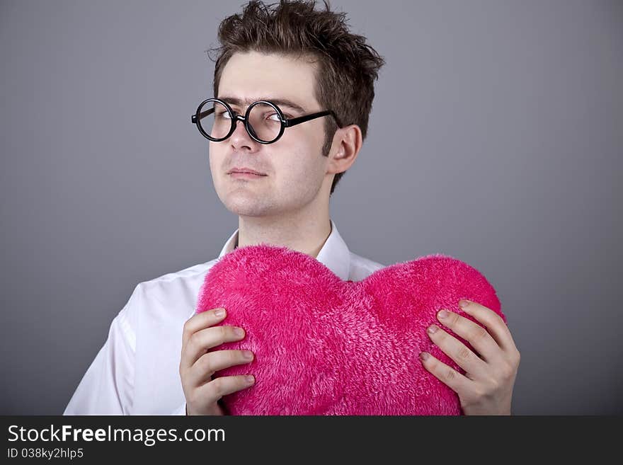 Funny men with toy heart.