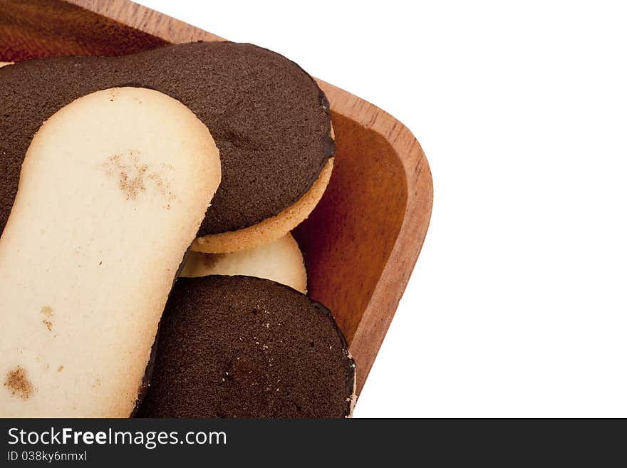 Biscuit dough with chocolate in a wooden bowl. Biscuit dough with chocolate in a wooden bowl.