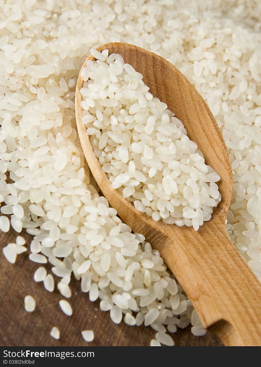 Rice grain in wooden spoon. Rice grain in wooden spoon