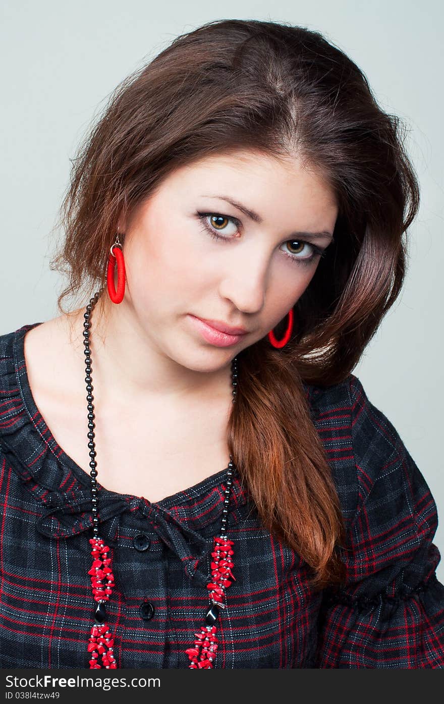 Portrait of beautiful young girl on the grey background. Portrait of beautiful young girl on the grey background