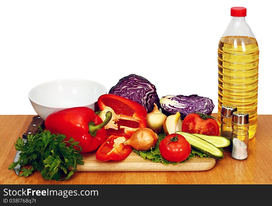 Sunflower seed oil and vegetables for preparation of salad. Sunflower seed oil and vegetables for preparation of salad