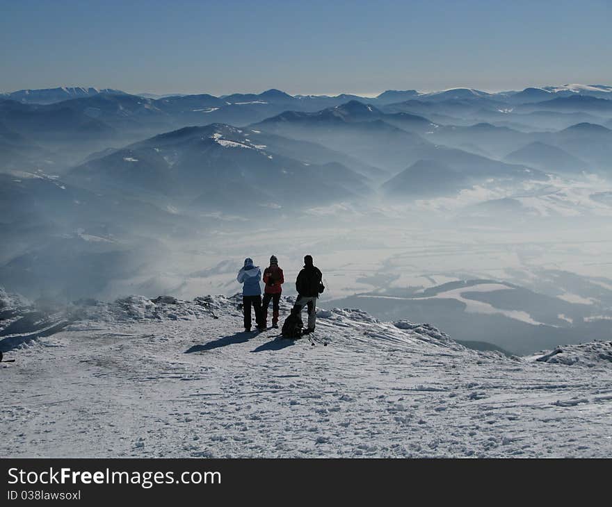 Tourist - three people on winter mountains trip