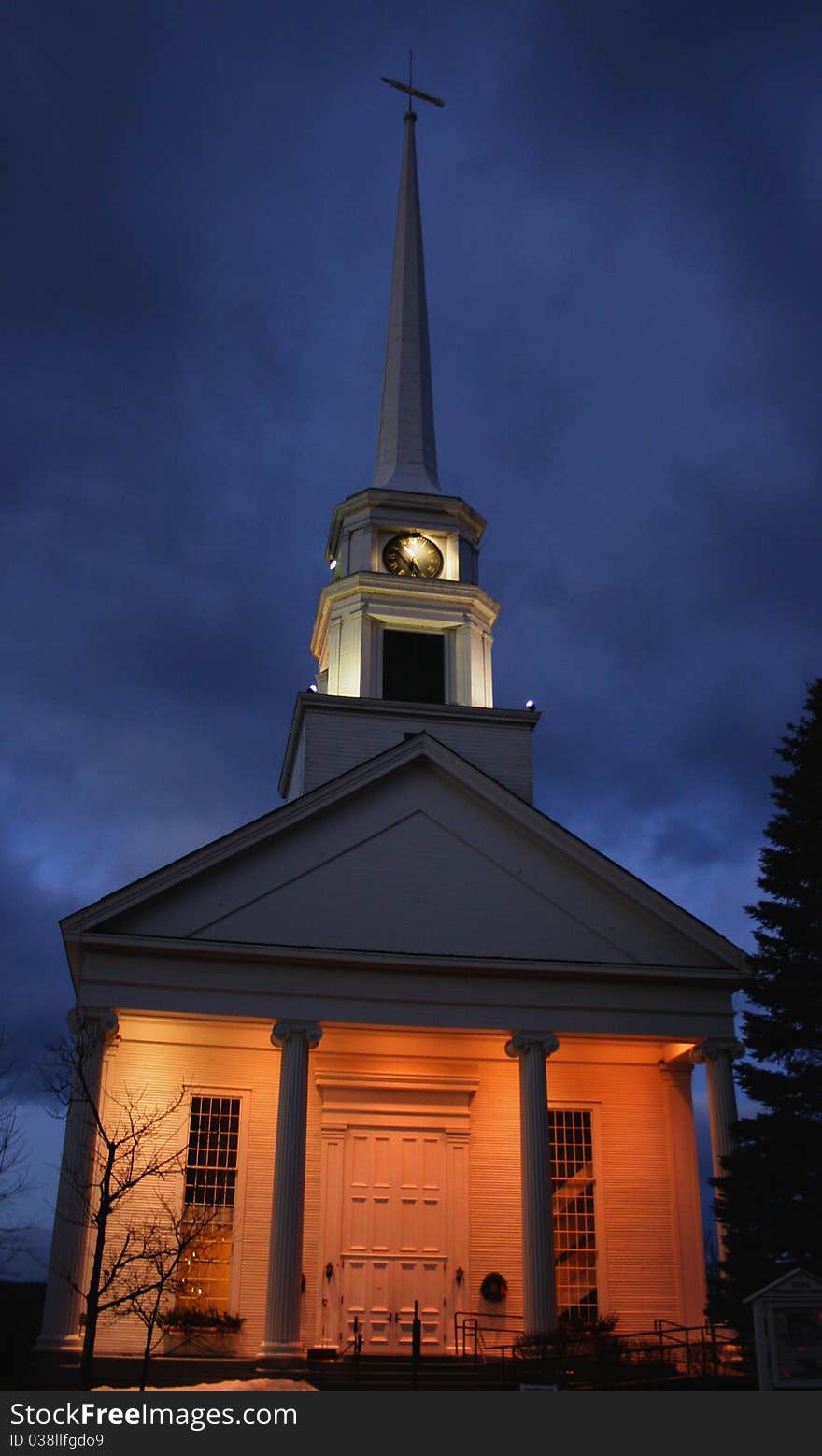 A country church lit up on a cold winter night. A country church lit up on a cold winter night.