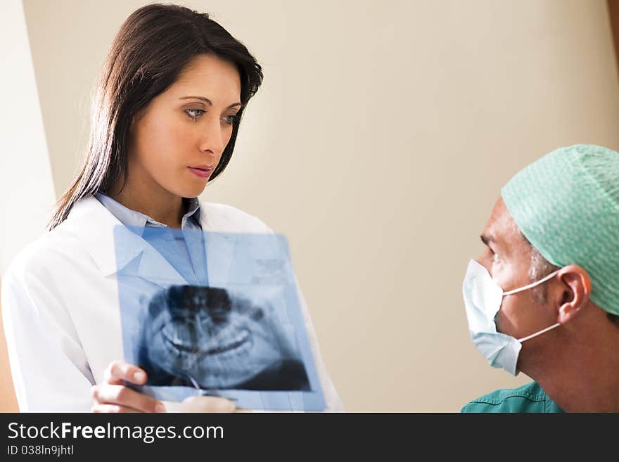 Two Dentists examining x-ray. Two Dentists examining x-ray