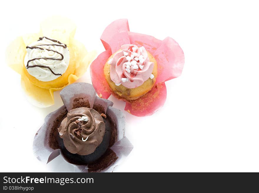 Three colorful muffin on a white background