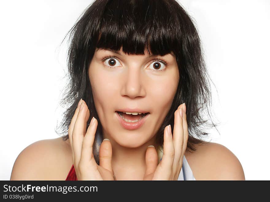 Portrait of a surprised girl with wide-opened eyes