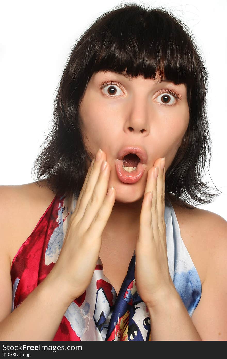 Portrait of a surprised girl on a white background