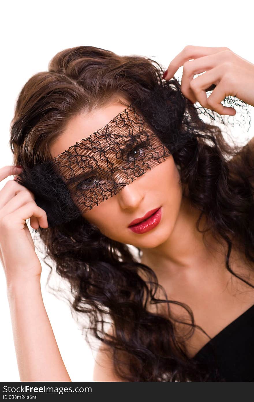 Portrait of young beautiful brunette woman with lace on her eyes