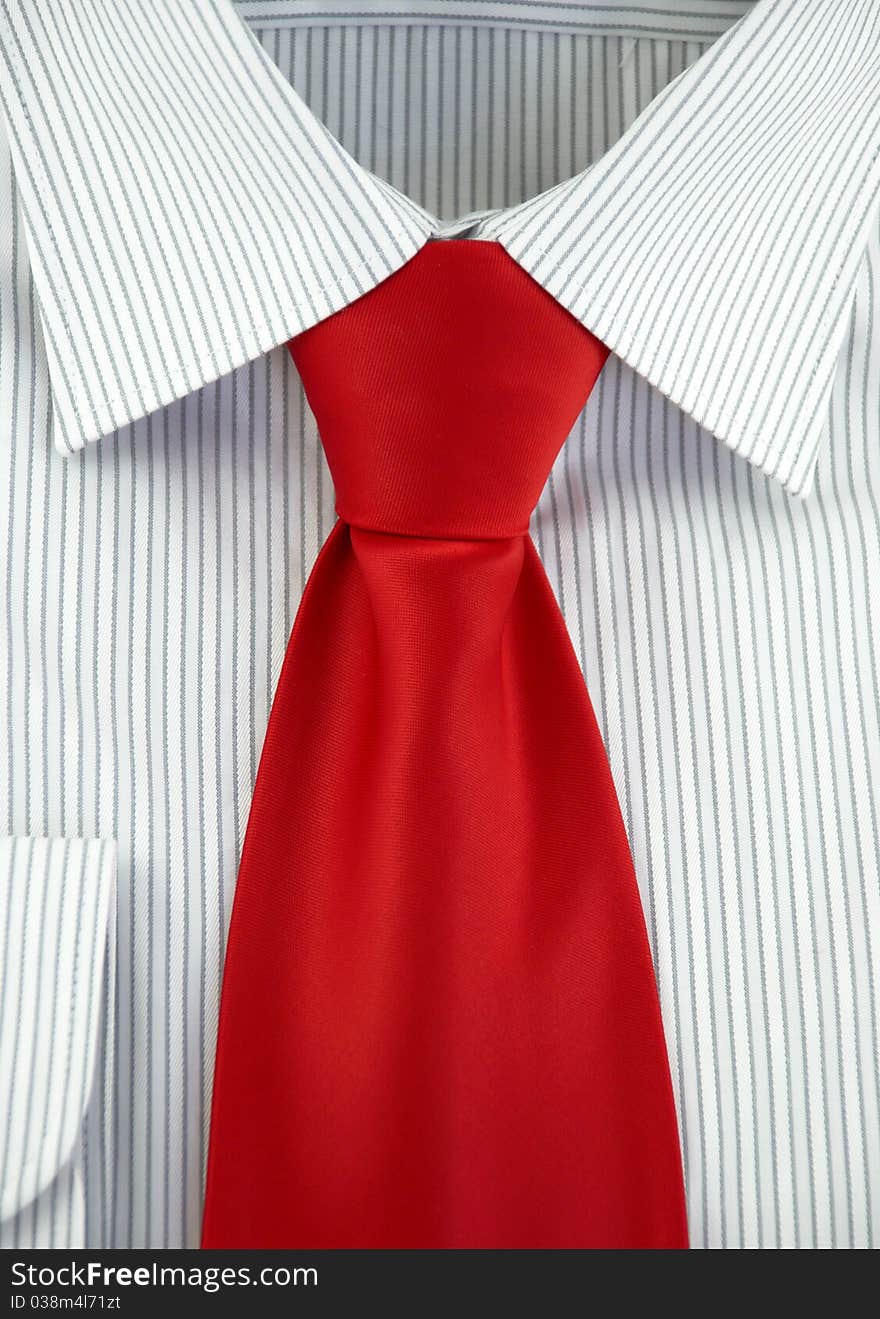 Striped shirt with red silk necktie