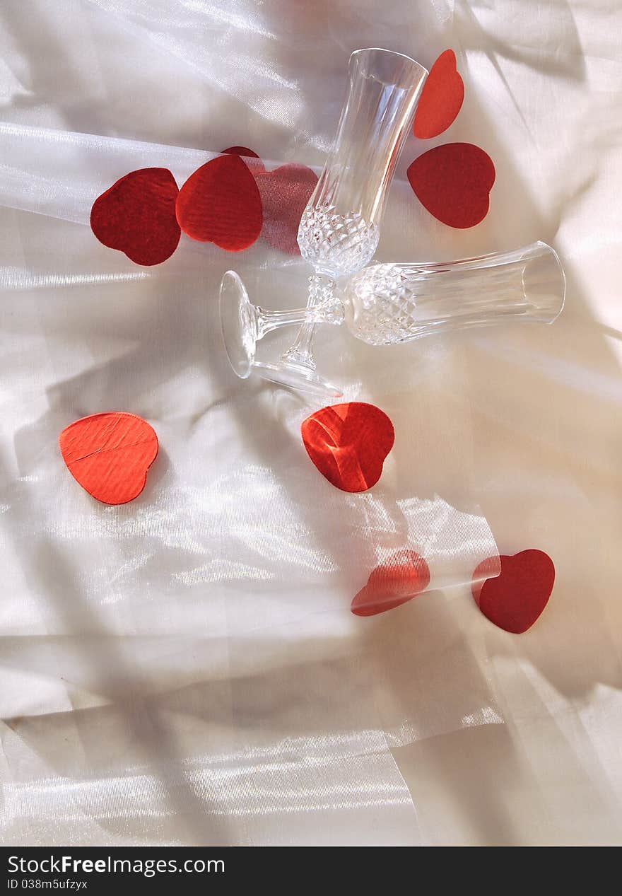 Champagne glasses and put on sheer heart shaped confetti. Champagne glasses and put on sheer heart shaped confetti