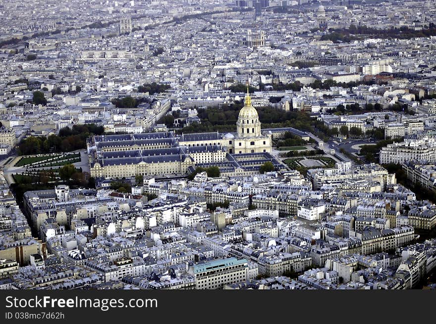 A bird's-eye view of Les Invalides of Paris, with its golden dome shining.