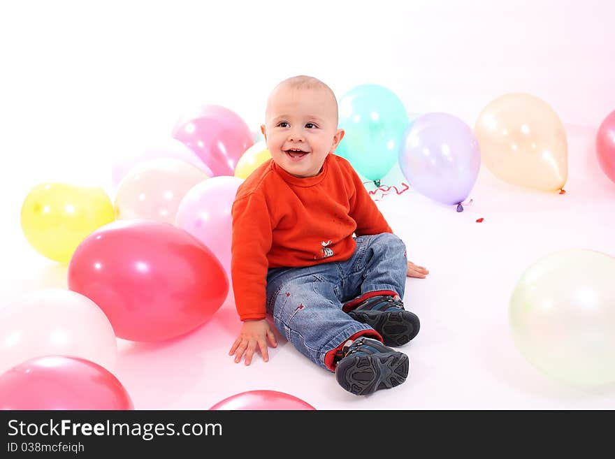 Little boy with colored balloons