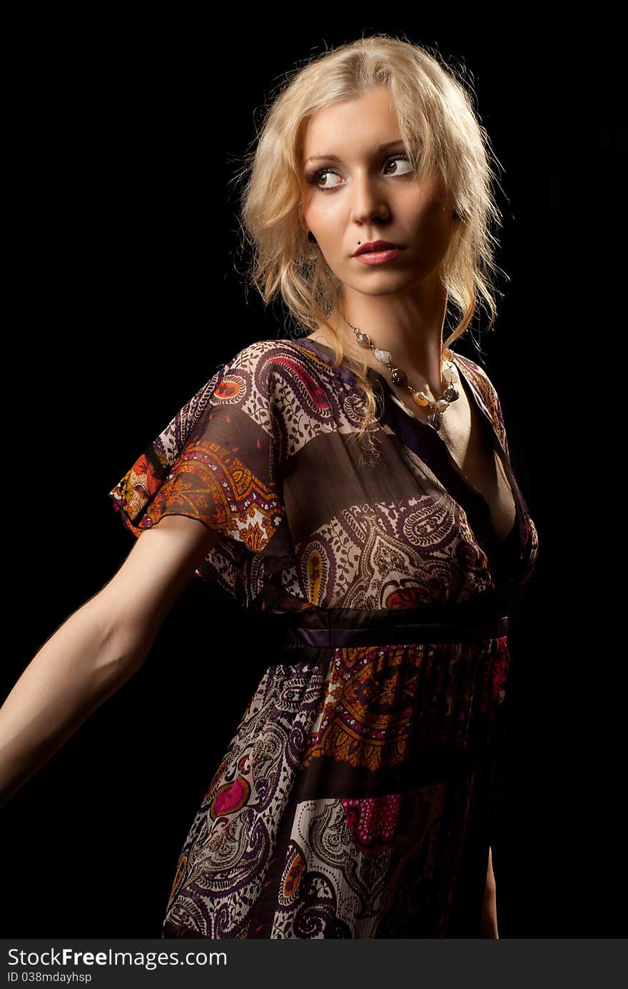 Portrait of a beautiful young woman. Black background. Studio shot. Portrait of a beautiful young woman. Black background. Studio shot.