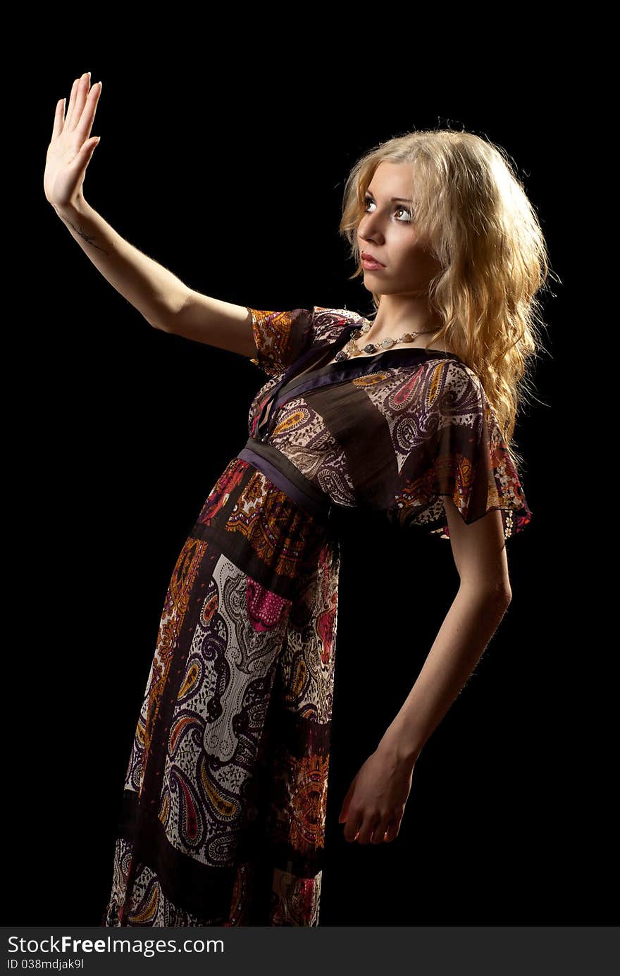 Portrait of a beautiful young woman. Black background. Studio shot. Portrait of a beautiful young woman. Black background. Studio shot.