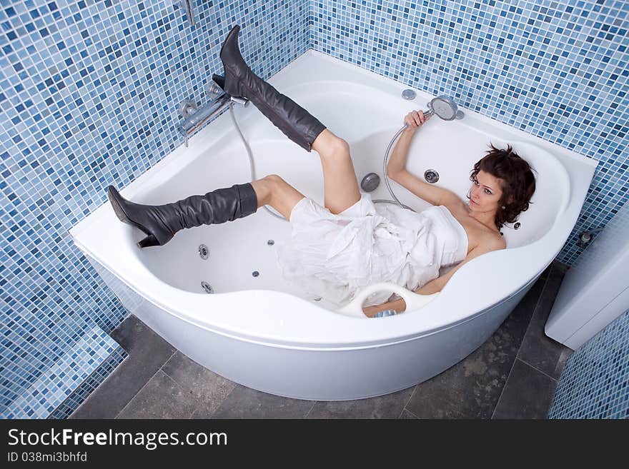 Woman bathing in stylish shoes. Woman bathing in stylish shoes