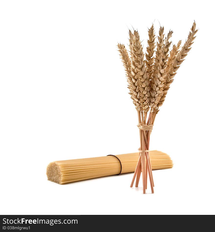 Wheat and spaghetti isolated on white background