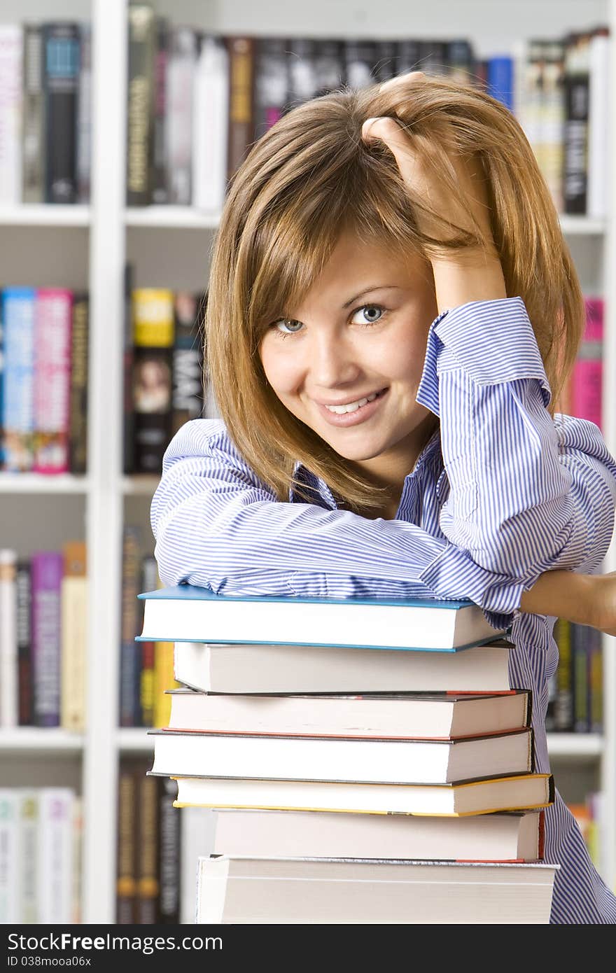 Young woman sitting  in  library