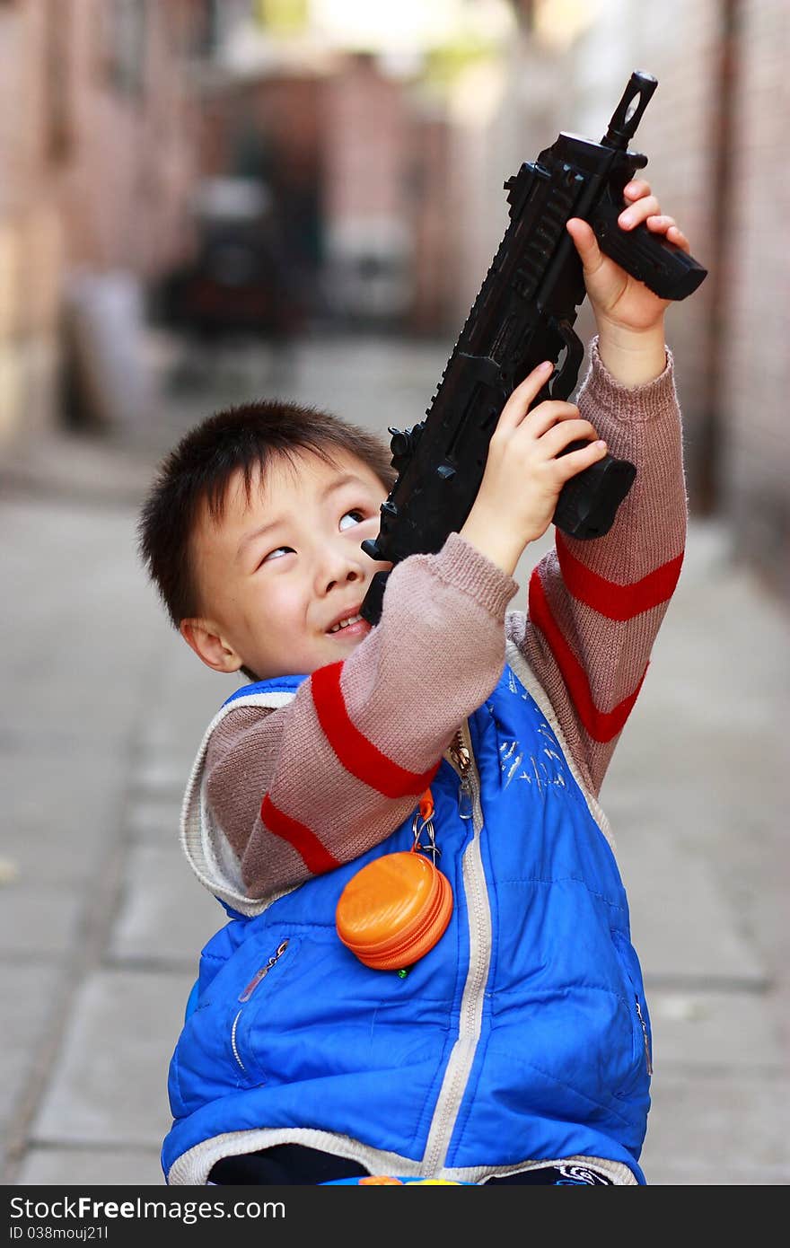 The portrait of an Asian boy with toy